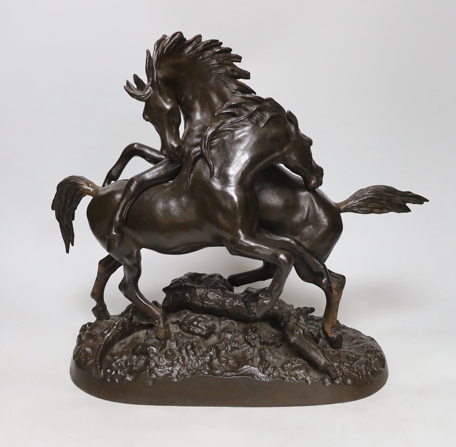 A bronzed cast iron horse group, 35cms high